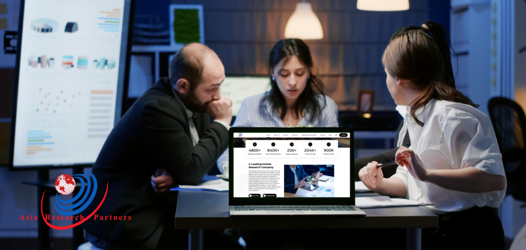 Group of 4 people discussing on office desk while lapptop open