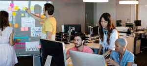 Design agency professionals working in their office