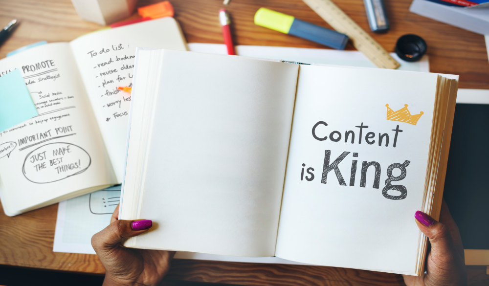 A book displaying "content is king"