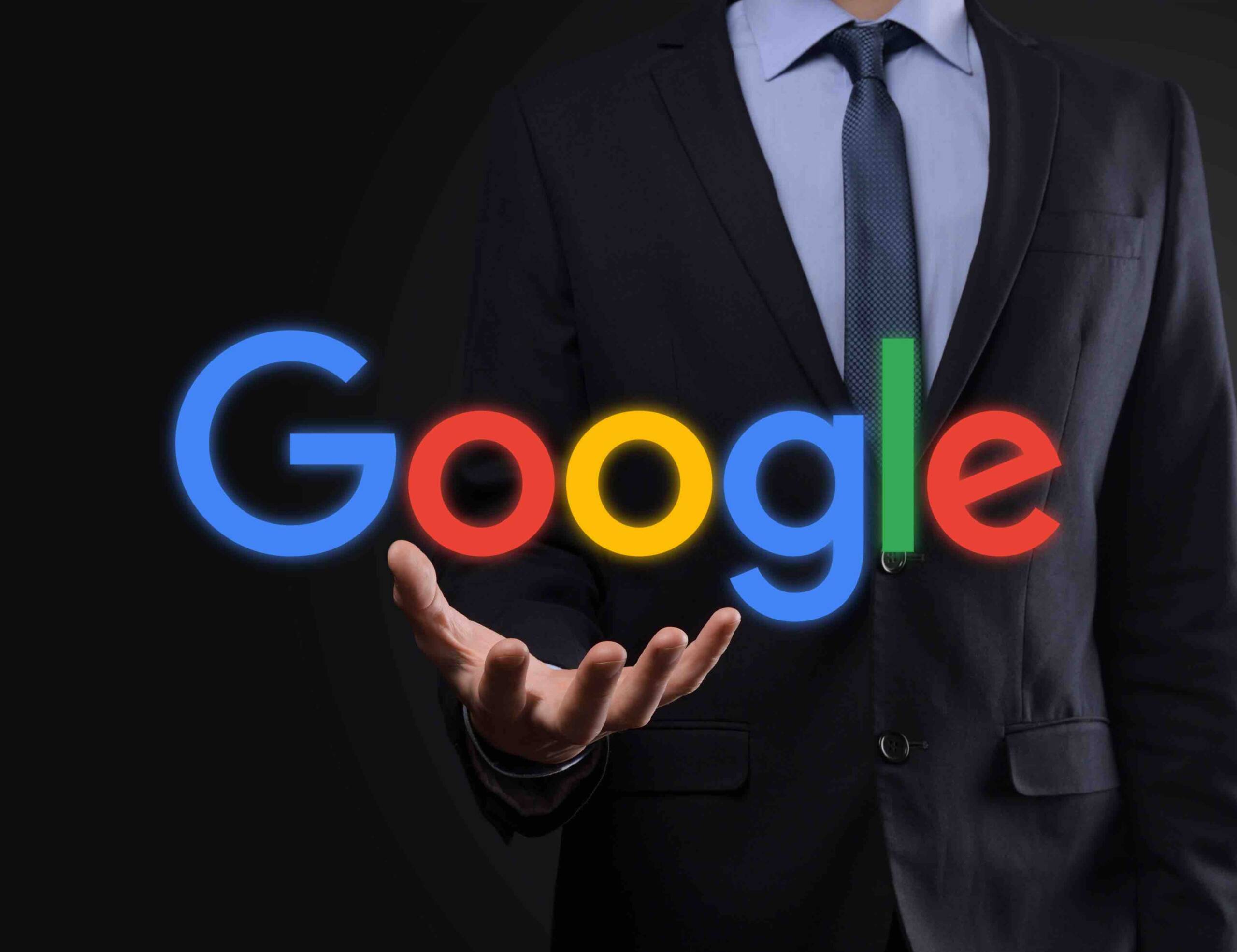 A person in suit holding the text Google