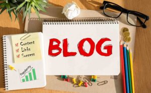 A notebook displaying BLOG text in red