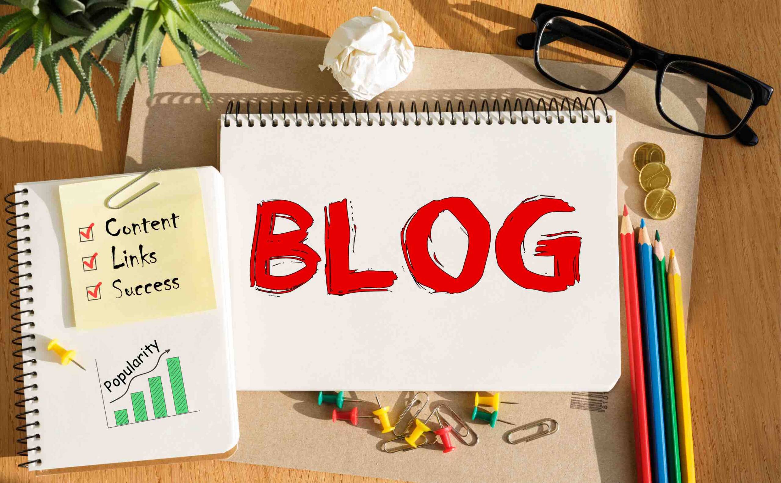 A notebook displaying BLOG text in red