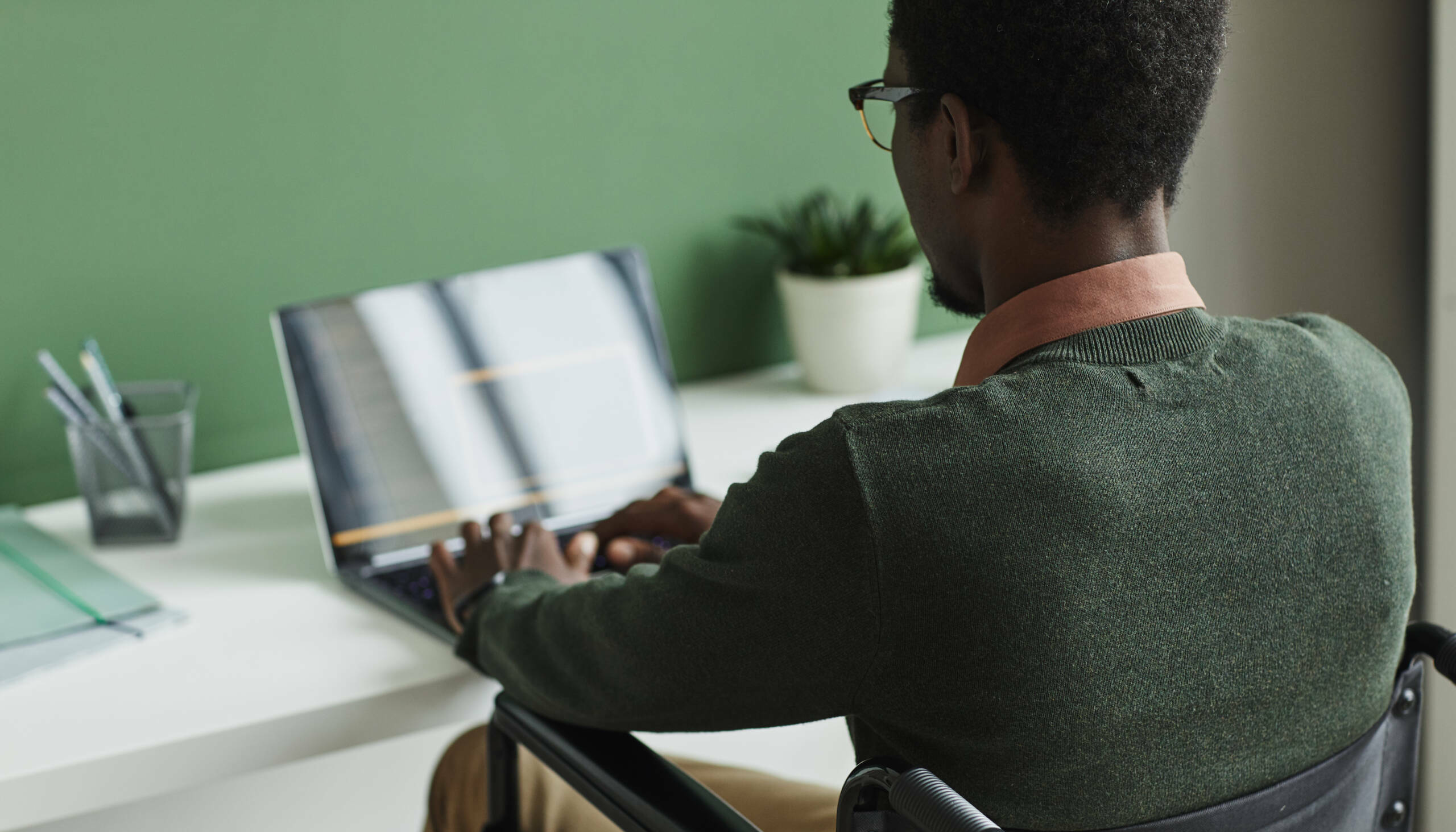 Disabled man working on laptop