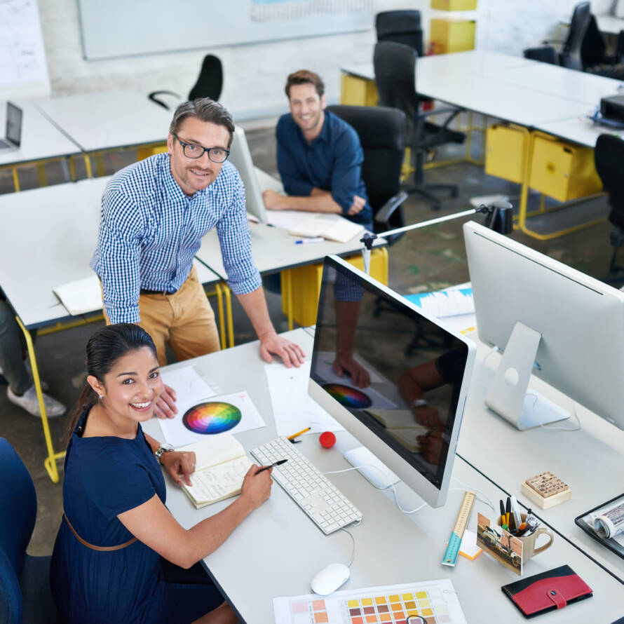 designers working at their computers in an office