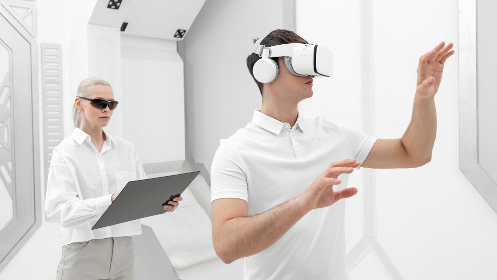 Young man using a VR headset while a woman tests the experience