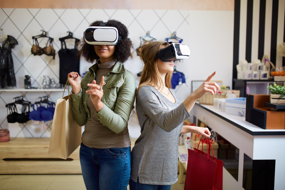 Two women in modern VR headsets having experience in shopping at lingerie store