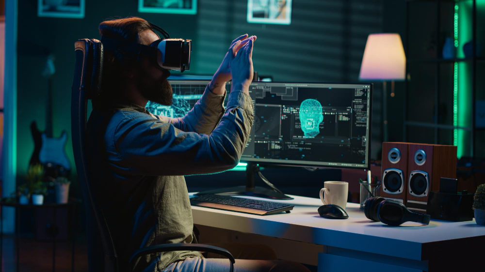 Bearded man wearing a VR headset, interacting with a virtual AI interface on a computer screen in a futuristic workspace.