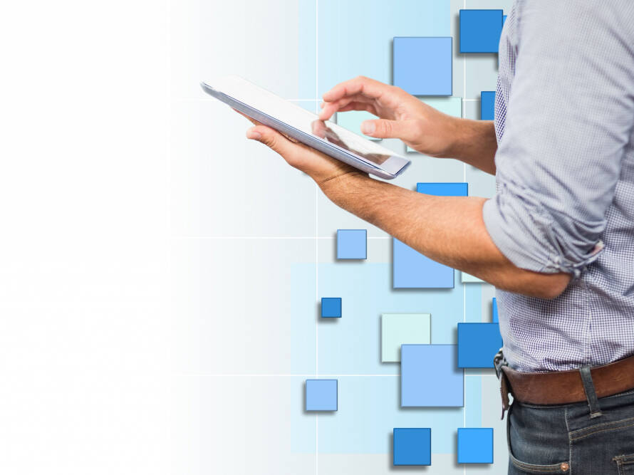 A man using his tablet with background in blue tones