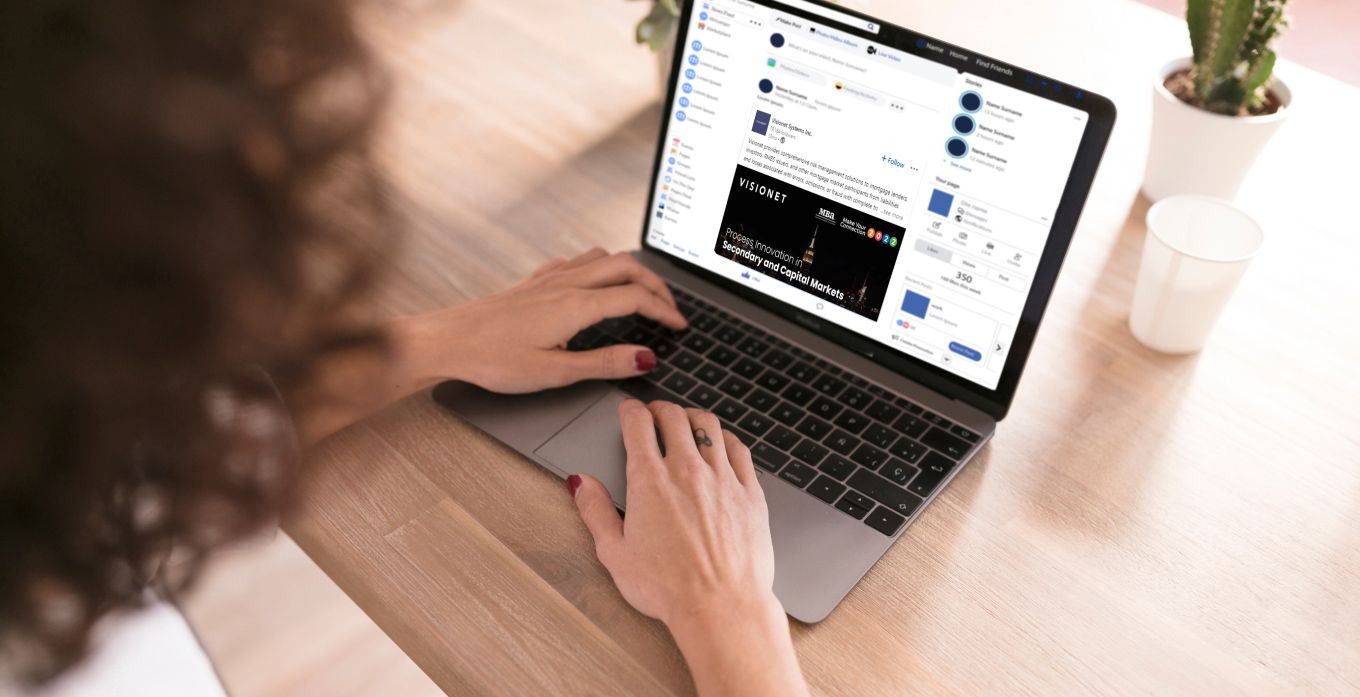 Lady browsing social media on laptop looking at visionet post