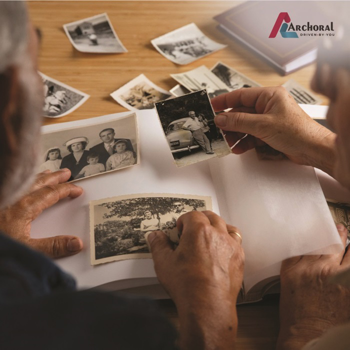 Old age people looking old photographs