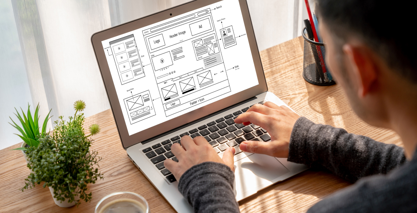 Man woorking on the wireframe on laptop
