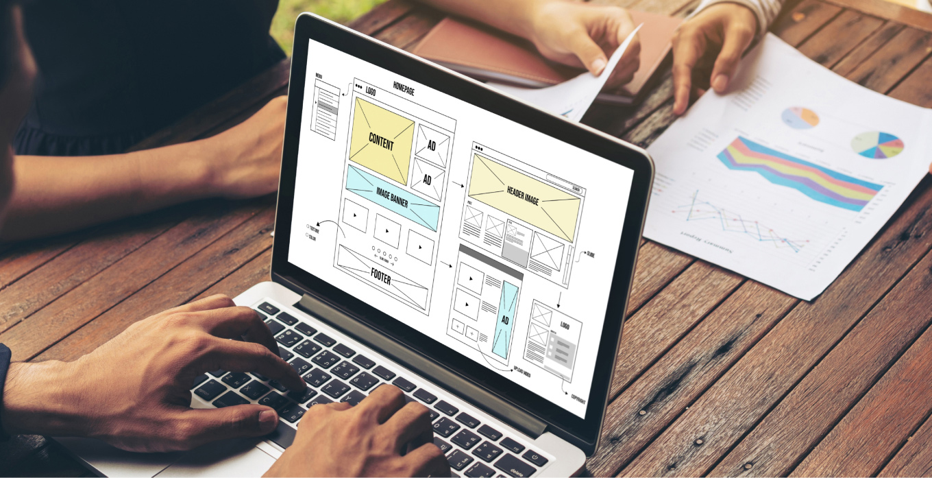 Man working on wireframe on laptop
