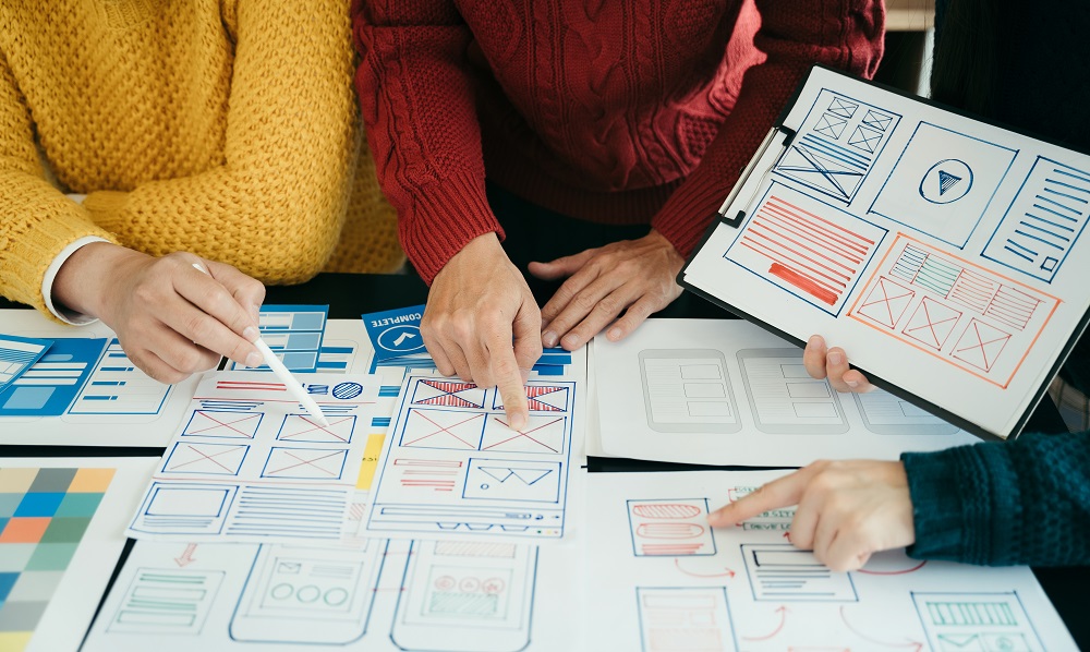 Creative team web designer planning application development for web mobile phone, laptop, smartphone and digital tablet at modern workplace.